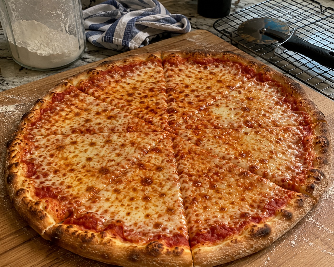 New York style pizza slice being held folded in one hand
